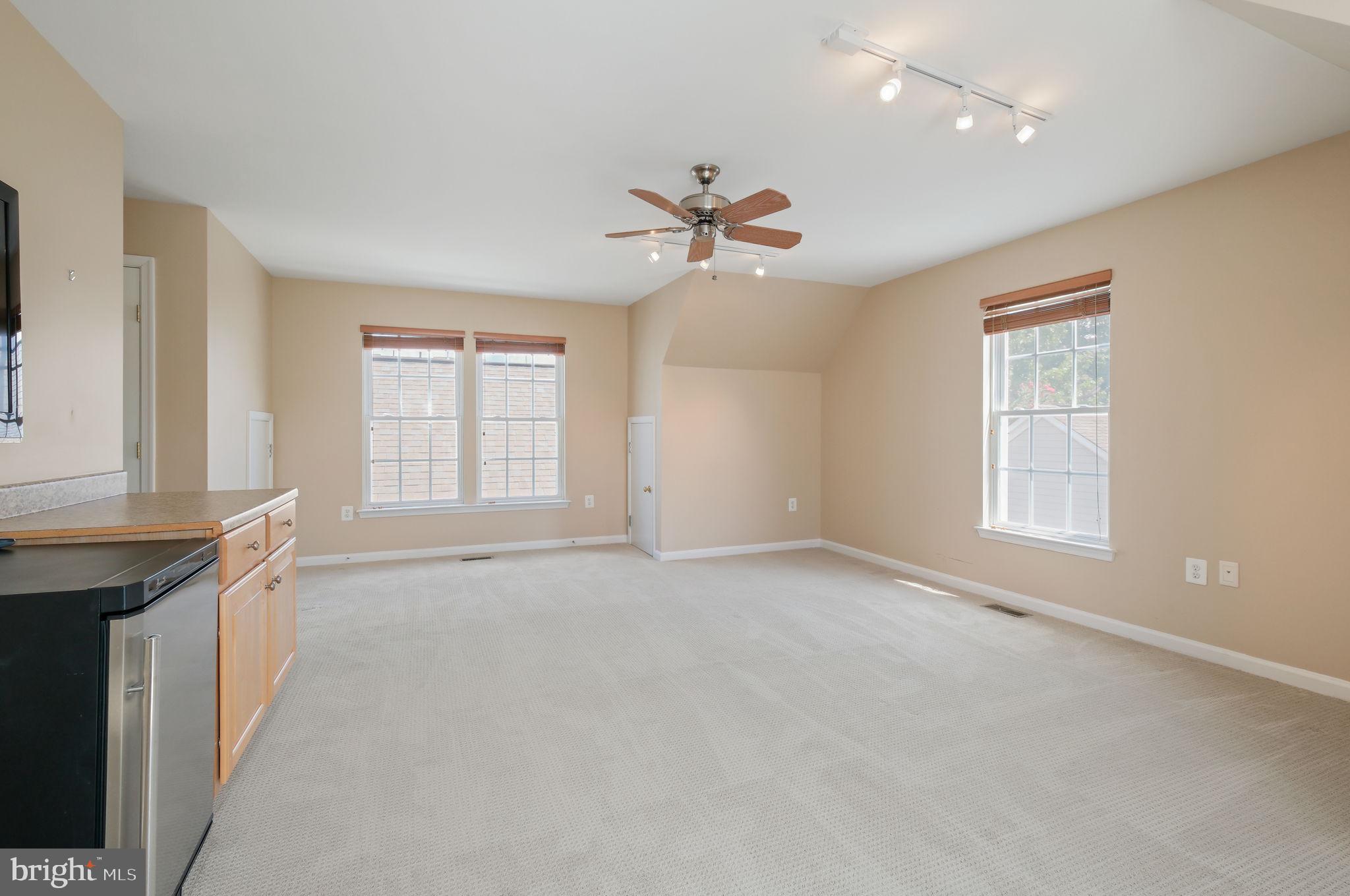 520 Kersten Street Gaithersburg, MD 20878 - Photo 40 of 63 an empty room with windows and fan