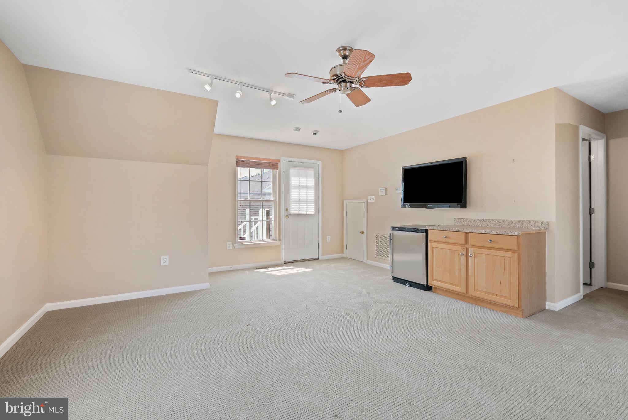 520 Kersten Street Gaithersburg, MD 20878 - Photo 42 of 63 a view of a livingroom with a flat screen tv