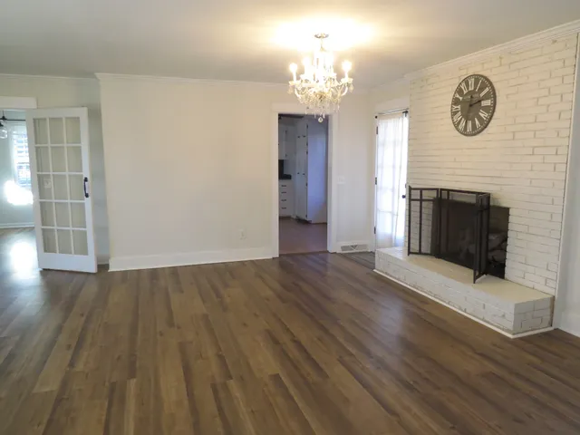 a view of a livingroom with wooden floor