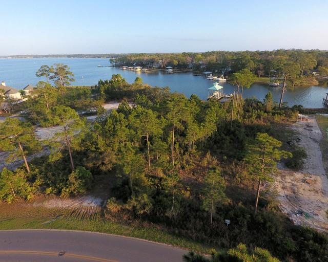 0 East Shipwreck Road Santa Rosa Beach, FL 32459 - Photo 14 of 17 a view of a lake with houses in the back