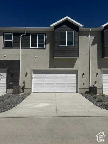80 South Moonlit Road Mapleton, UT 84664 - Photo 18 of 18 Traditional home with stucco siding, an attached garage, and driveway