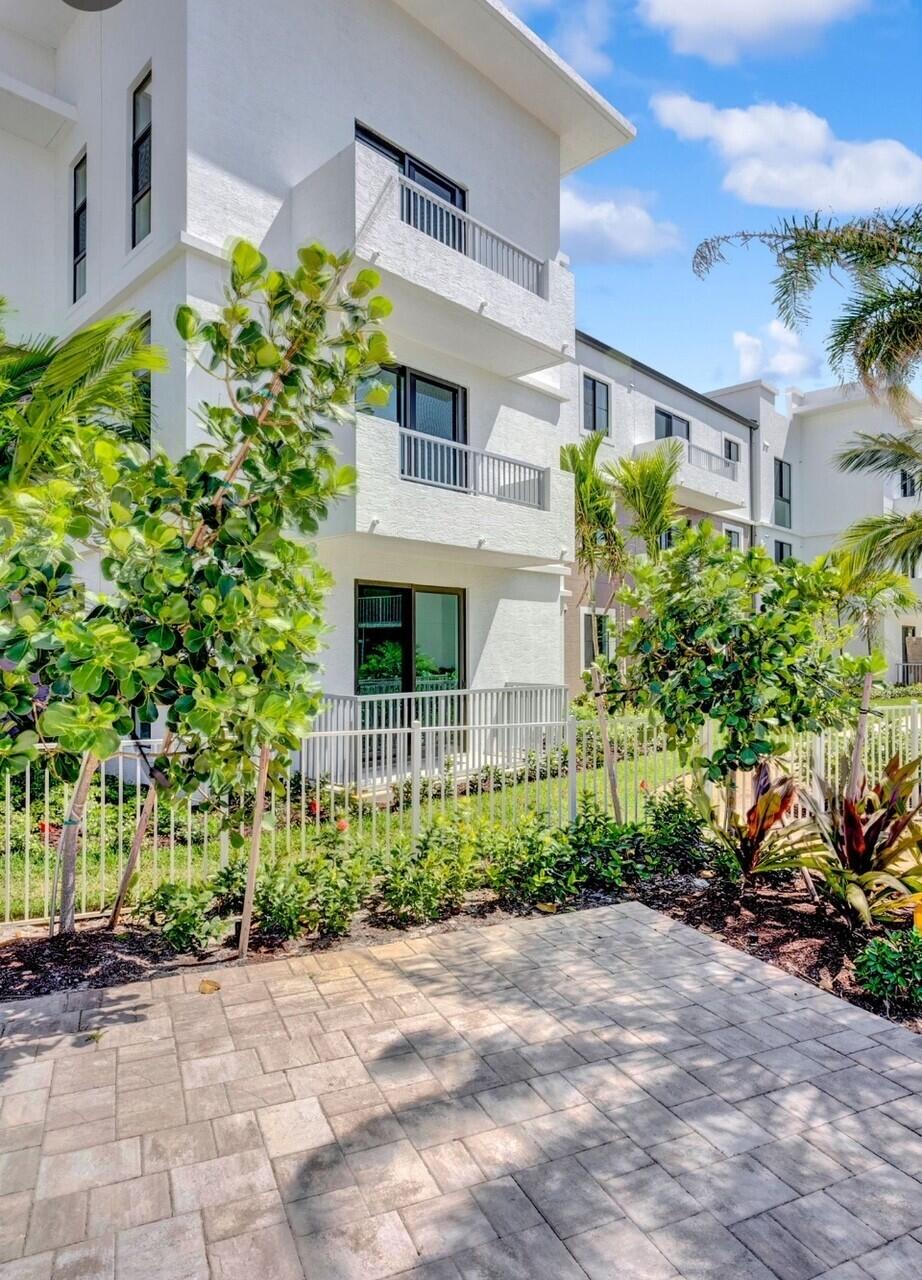 250 West Hidden Valley Boulevard, Unit 3 Boca Raton, FL 33487 - Photo 22 of 27 a view of a garden with potted plants