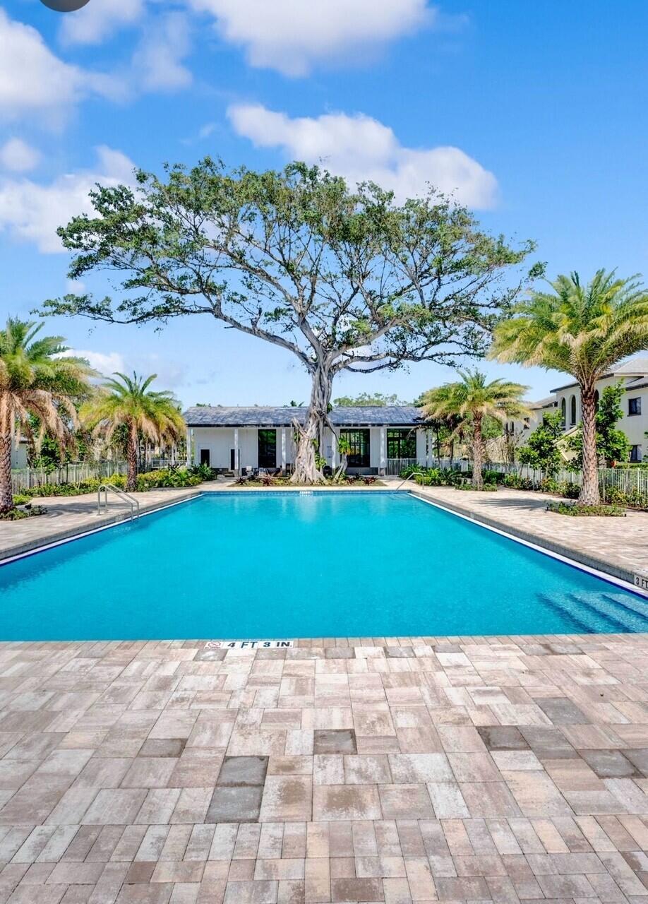 250 West Hidden Valley Boulevard, Unit 3 Boca Raton, FL 33487 - Photo 23 of 27 a view of building with yard