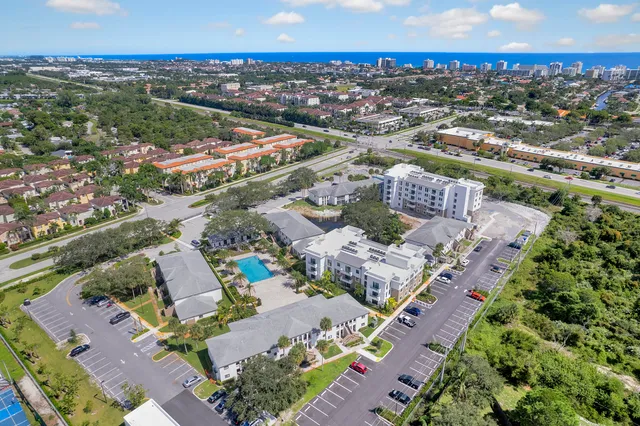 an aerial view of residential houses with outdoor space