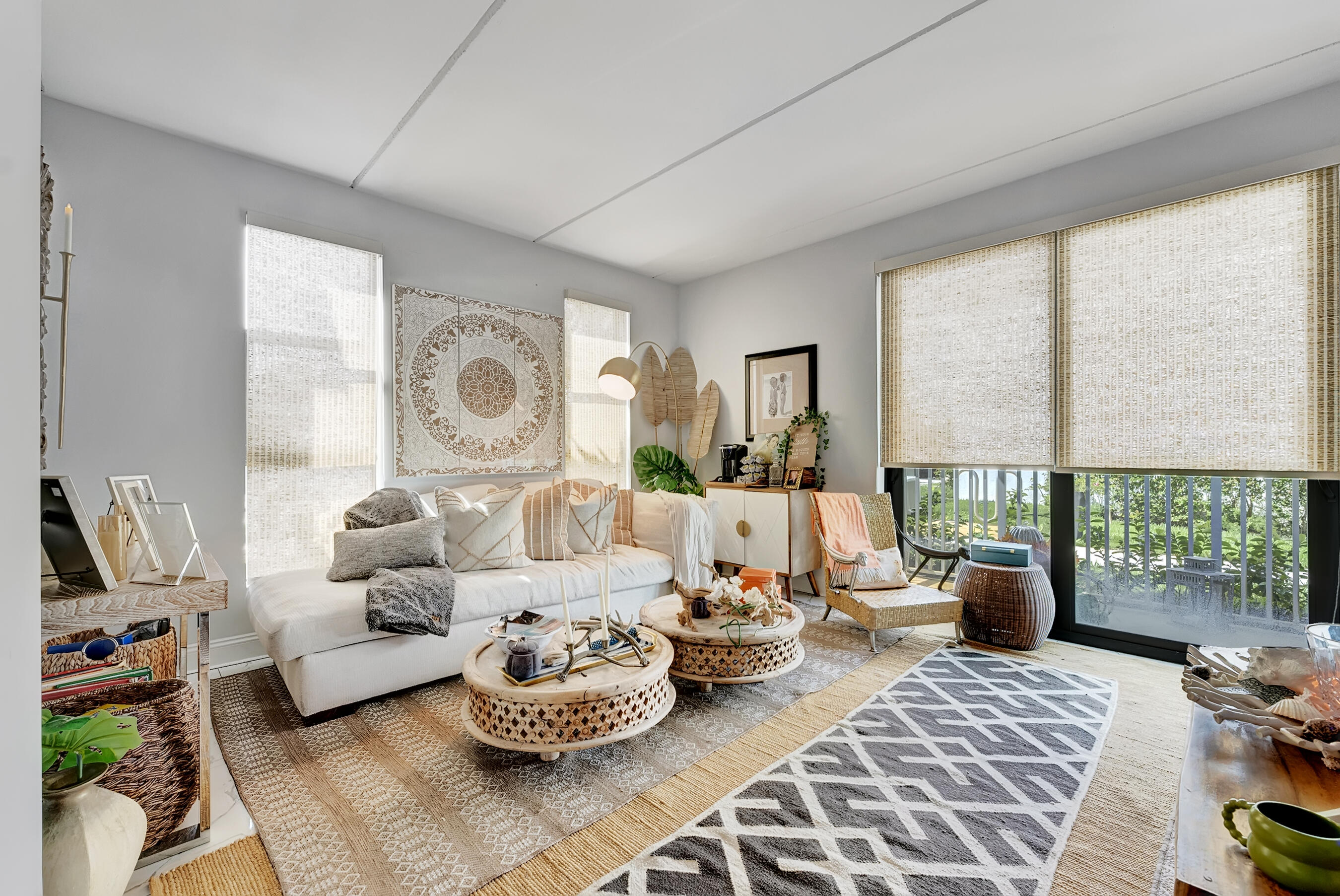 250 West Hidden Valley Boulevard, Unit 3 Boca Raton, FL 33487 - Photo 8 of 27 a living room with furniture and a large window