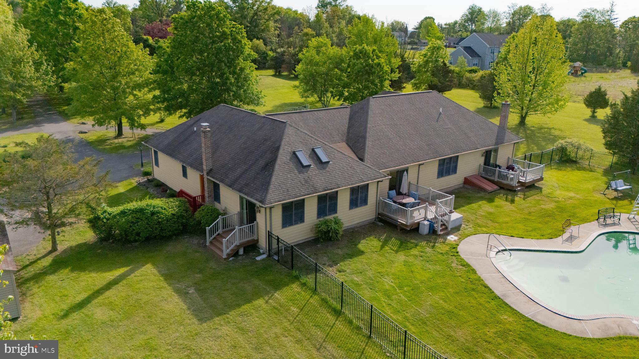 3494 Finland Road Pennsburg, PA 18073 - Photo 46 of 63 an aerial view of a house with swimming pool and garden