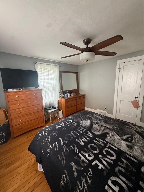 66 Powell Avenue Springfield, MA 01118 - Photo 16 of 31 a bedroom with a bed and a dresser