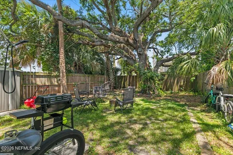 a view of a pathway with a wrought fence