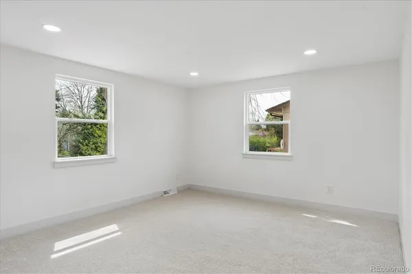 an empty room with windows