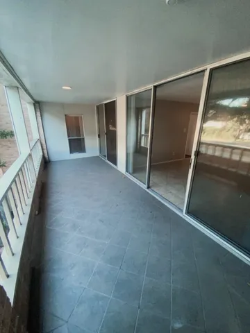a kitchen with cabinets and refrigerator