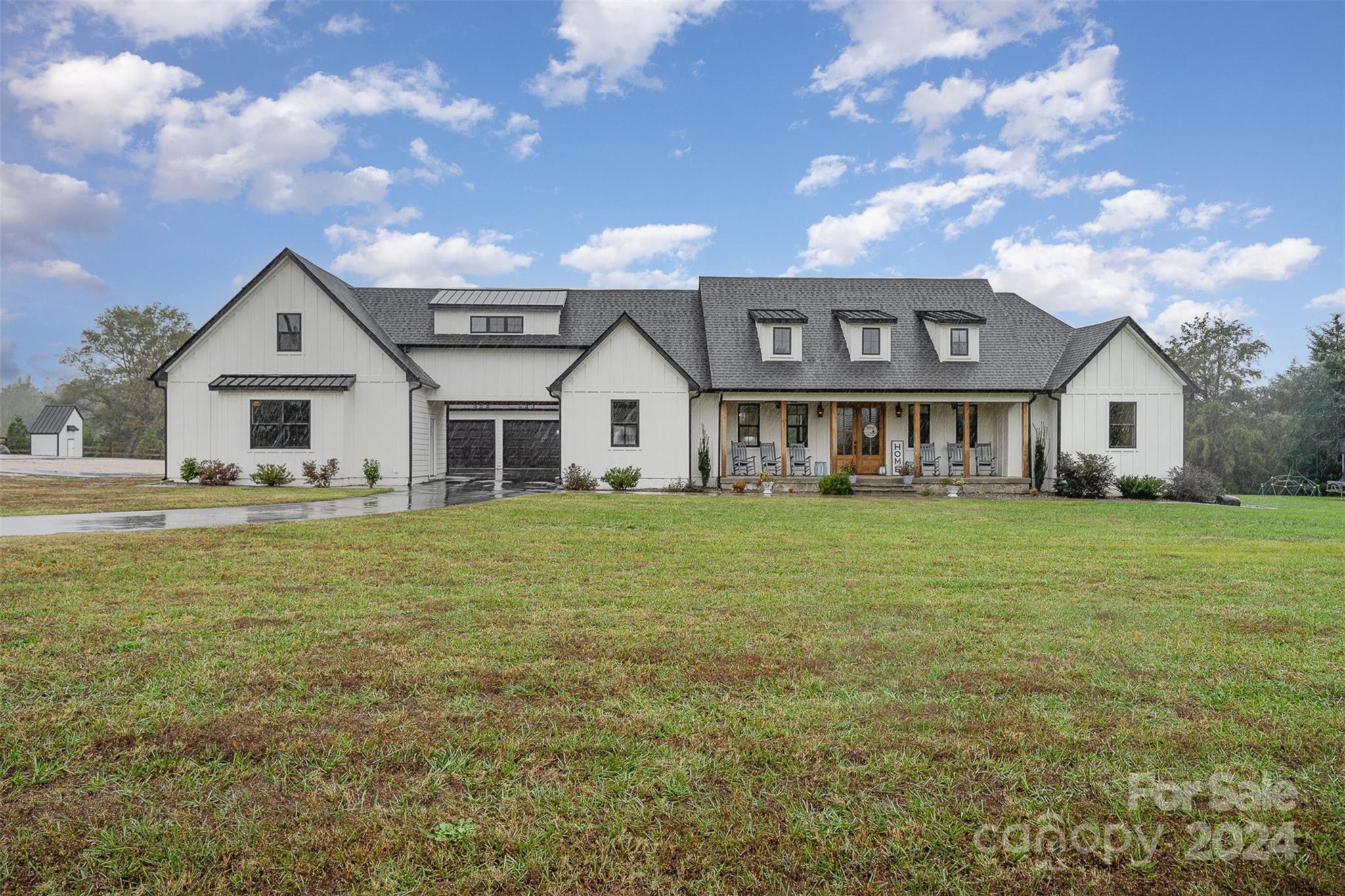 2369 State Rd S-46-172 Clover, SC 29710 - Photo 6 of 48 a front view of a house with a garden