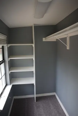 a view of an empty walk in closet