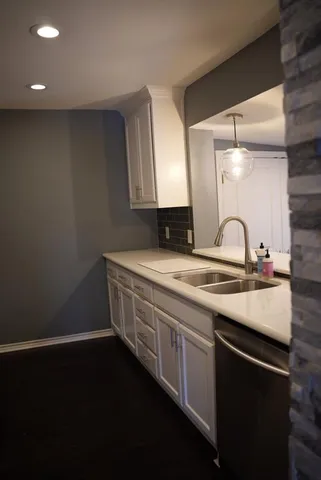 a sink with granite countertop