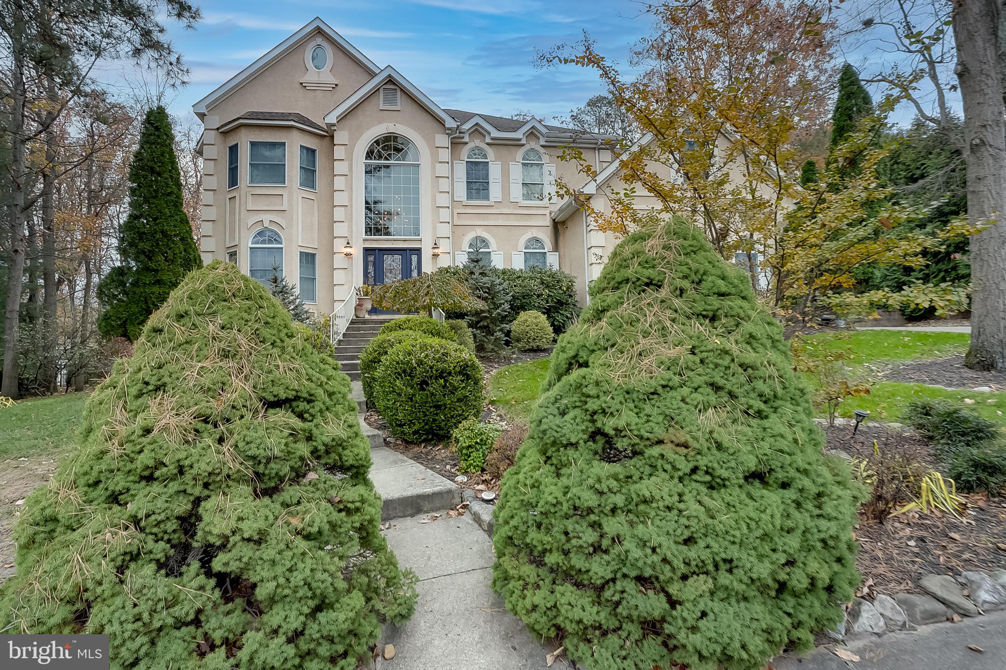 6 Oak Ridge Drive Voorhees, NJ 08043 - Photo 2 of 52 a view of a yard in front of house