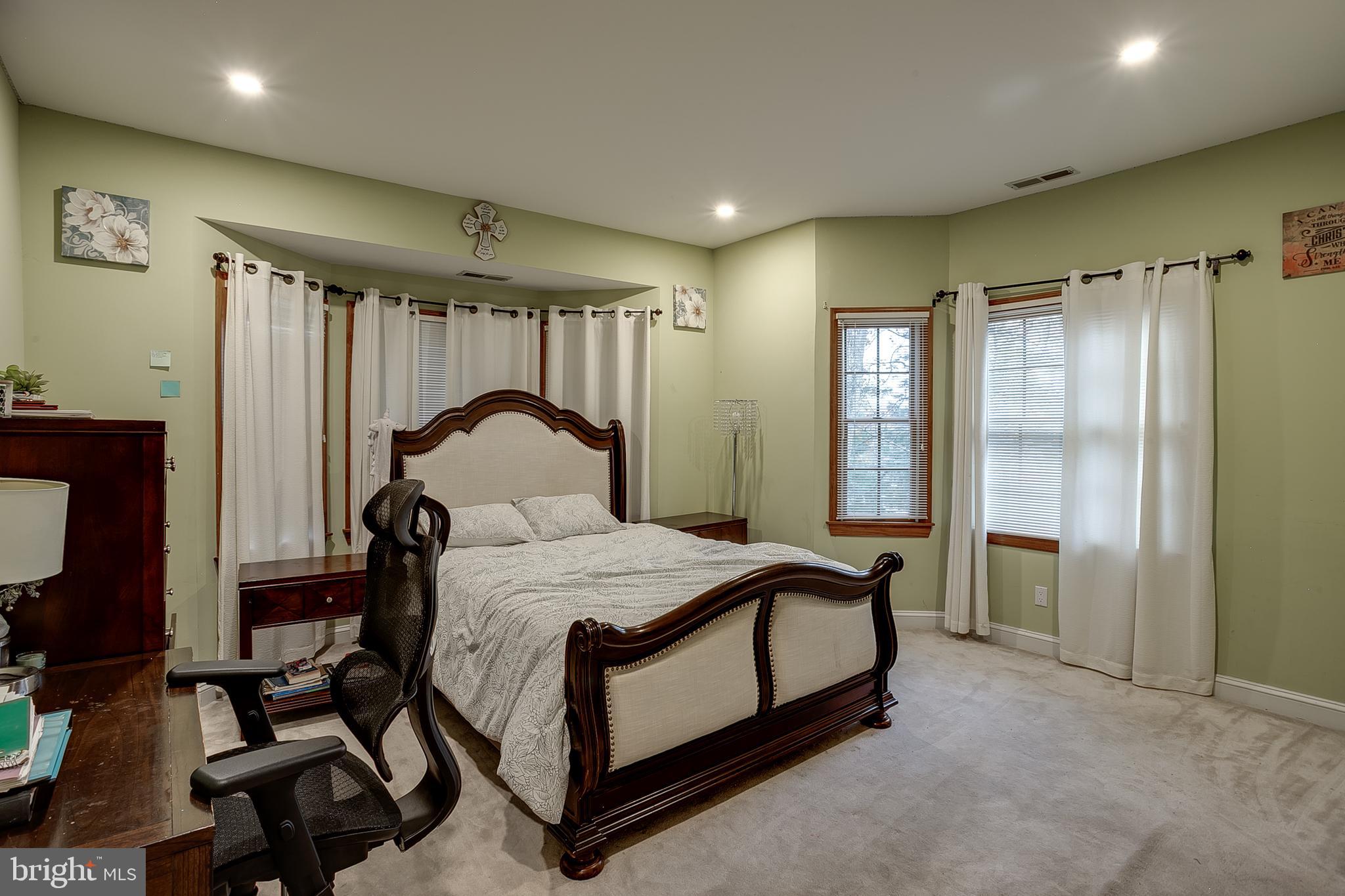6 Oak Ridge Drive Voorhees, NJ 08043 - Photo 36 of 52 a bedroom with a bed lamp and a window