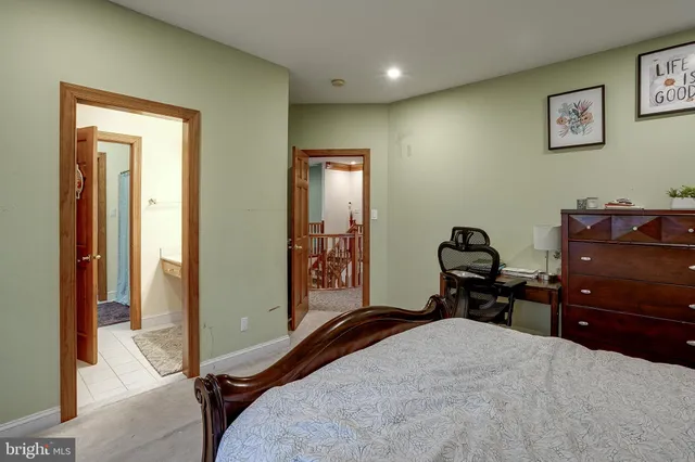 a bedroom with two beds and a large window