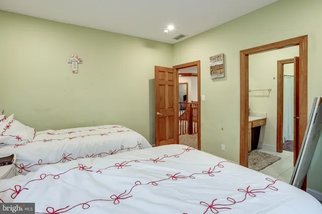 a bathroom with a sink vanity granite tub and shower