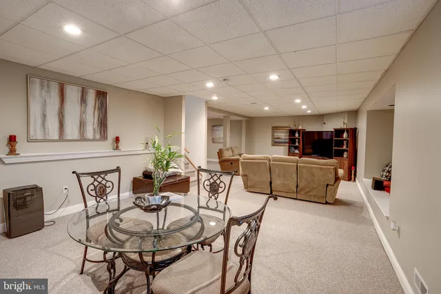 a bathroom with a toilet a sink and a mirror