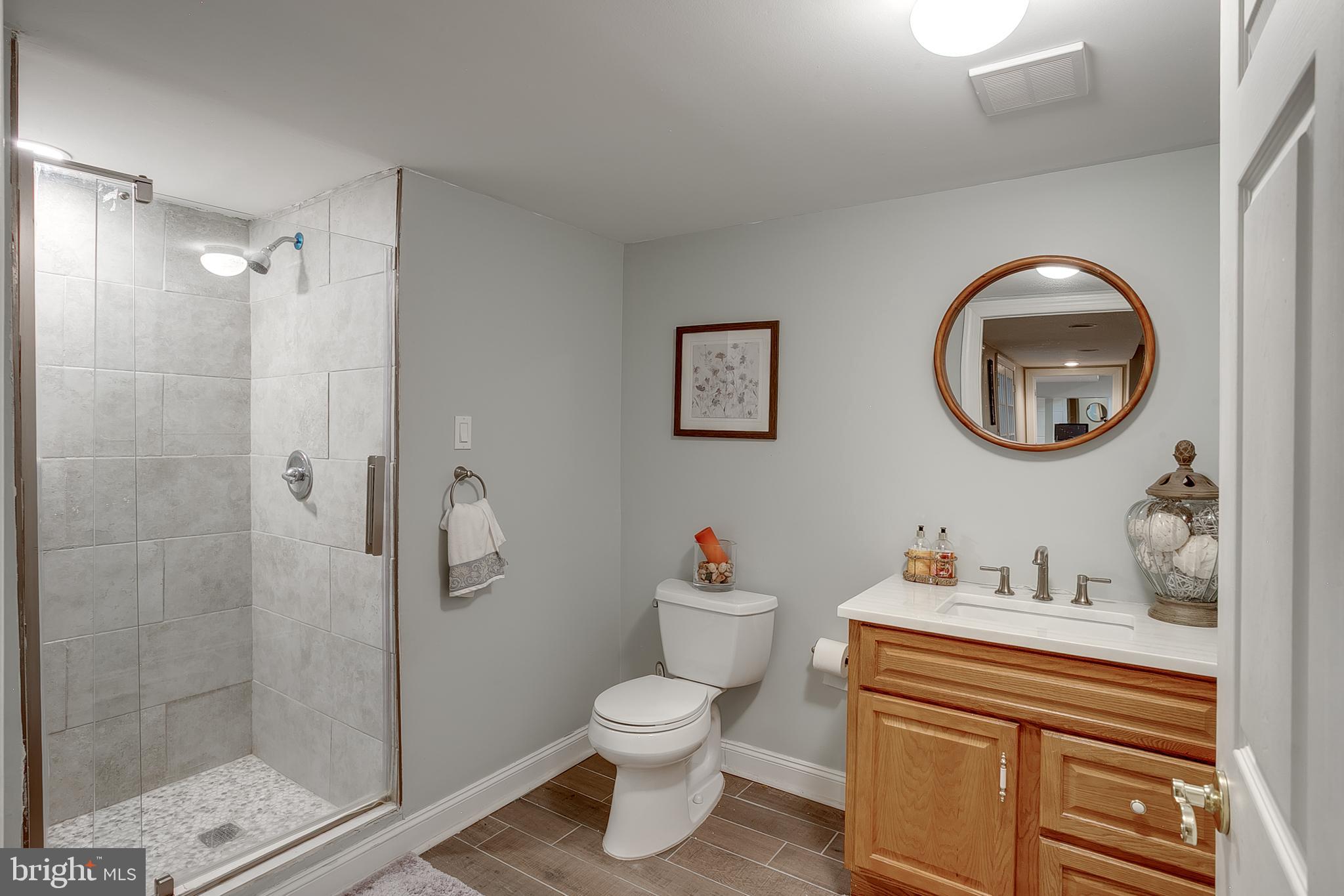 6 Oak Ridge Drive Voorhees, NJ 08043 - Photo 46 of 52 a bathroom with a toilet a sink and a mirror