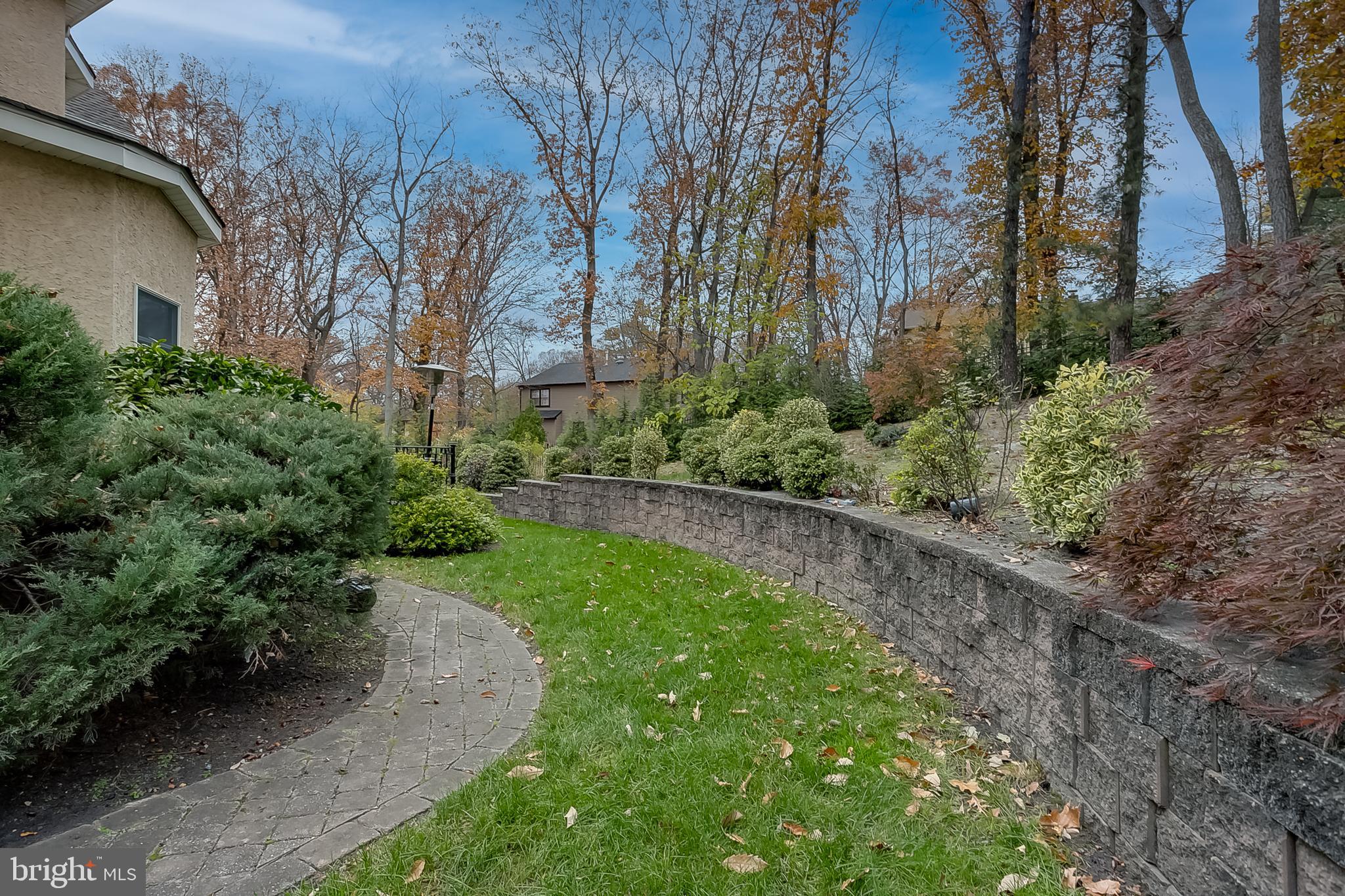 6 Oak Ridge Drive Voorhees, NJ 08043 - Photo 52 of 52 a view of a backyard with potted plants and large trees