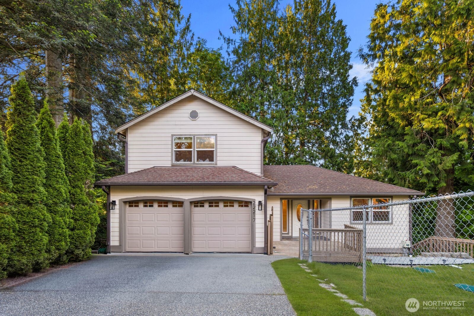 22217 Old Owen Road Monroe, WA 98272 - Photo 1 of 34 a front view of a house with a garden and yard
