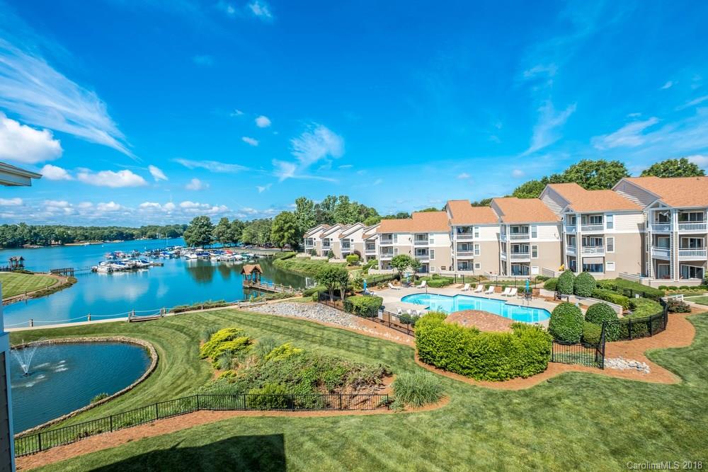 1115 Torrence Circle, Unit 63 Davidson, NC 28036 - Photo 17 of 23 a view of a lake with a house