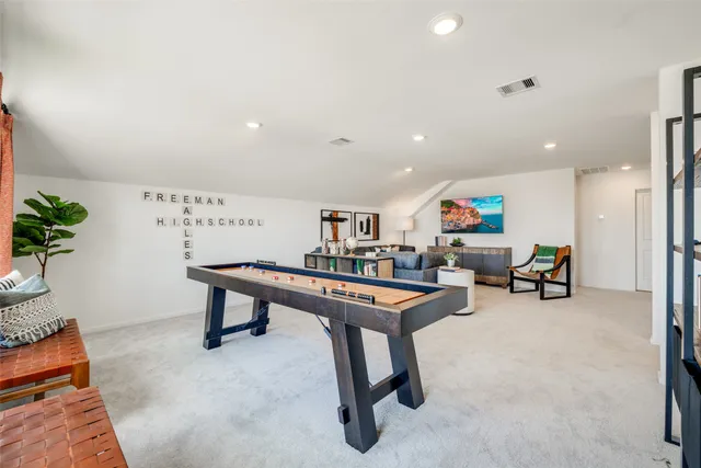 a room with furniture and a potted plant