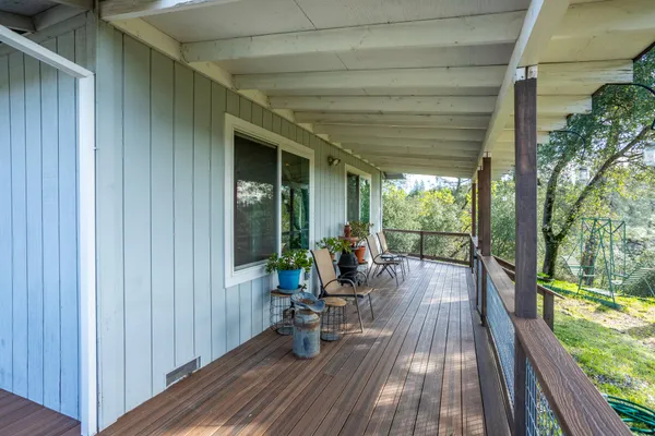 a view of two chairs in the balcony