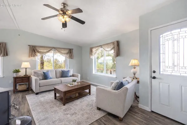 a living room with furniture and a window