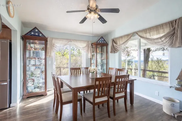 a view of a dining room with furniture window and outside view