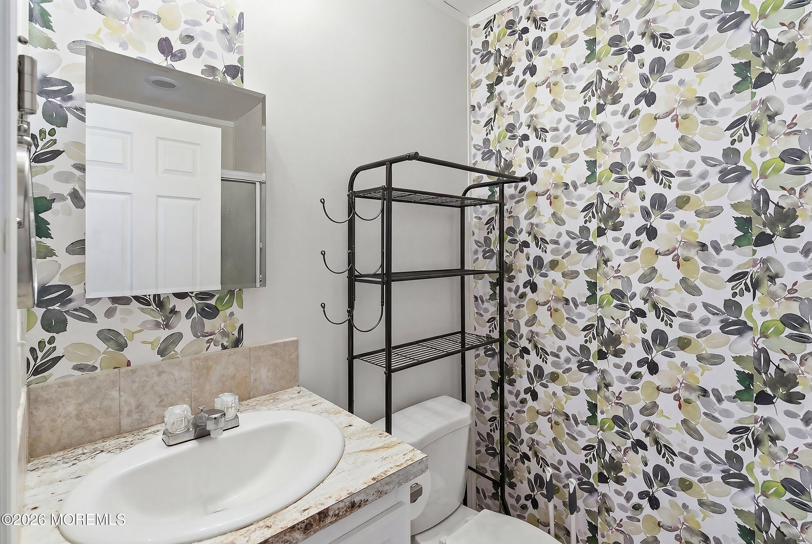 511 Sykesville Road, Unit 116 Wrightstown, NJ 08562 - Photo 14 of 14 a bathroom with a sink toilet and shower