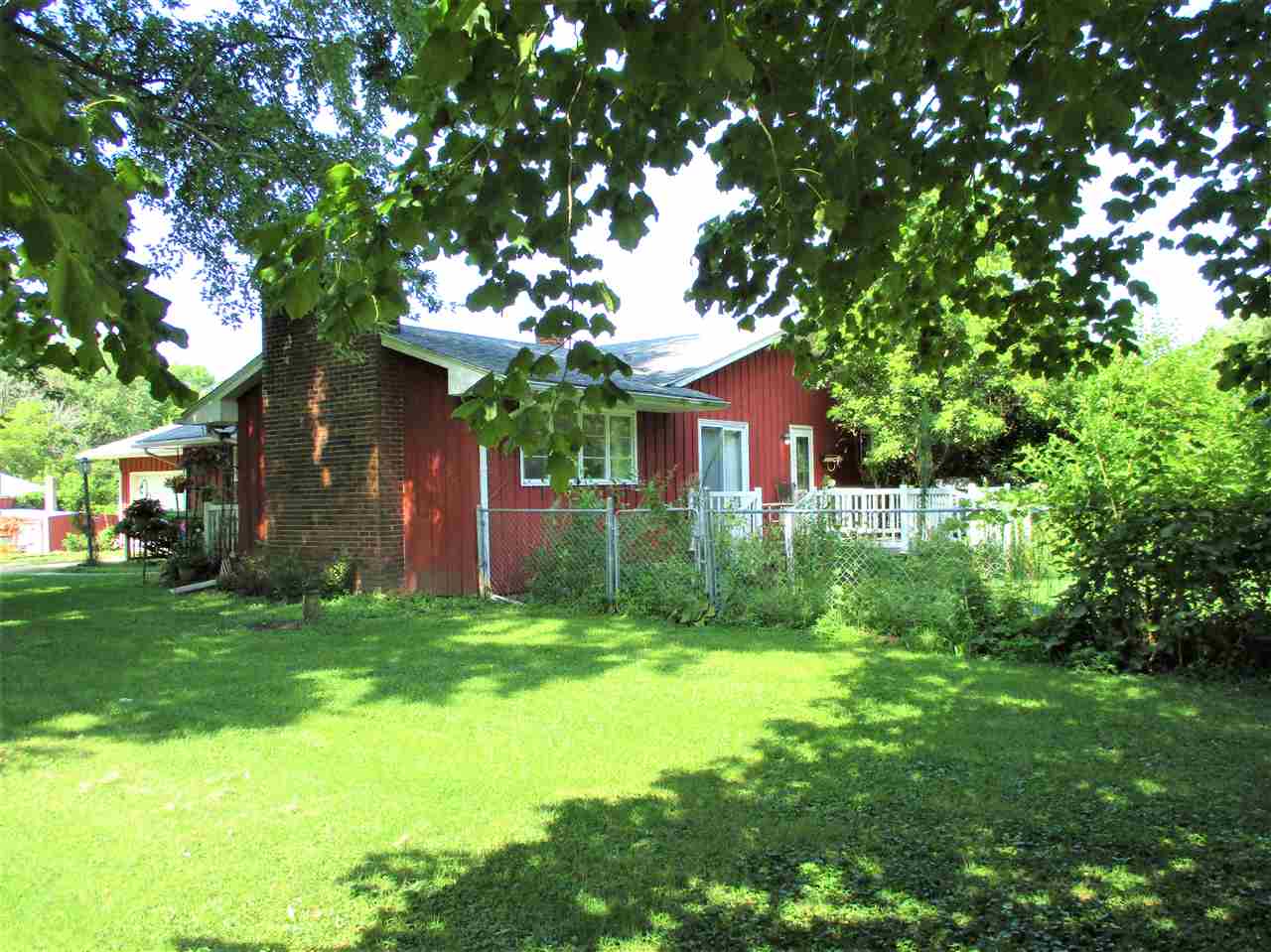 10641 Cemetery Road Pecatonica, IL 61063 - Photo 4 of 25 a front view of a house with a yard