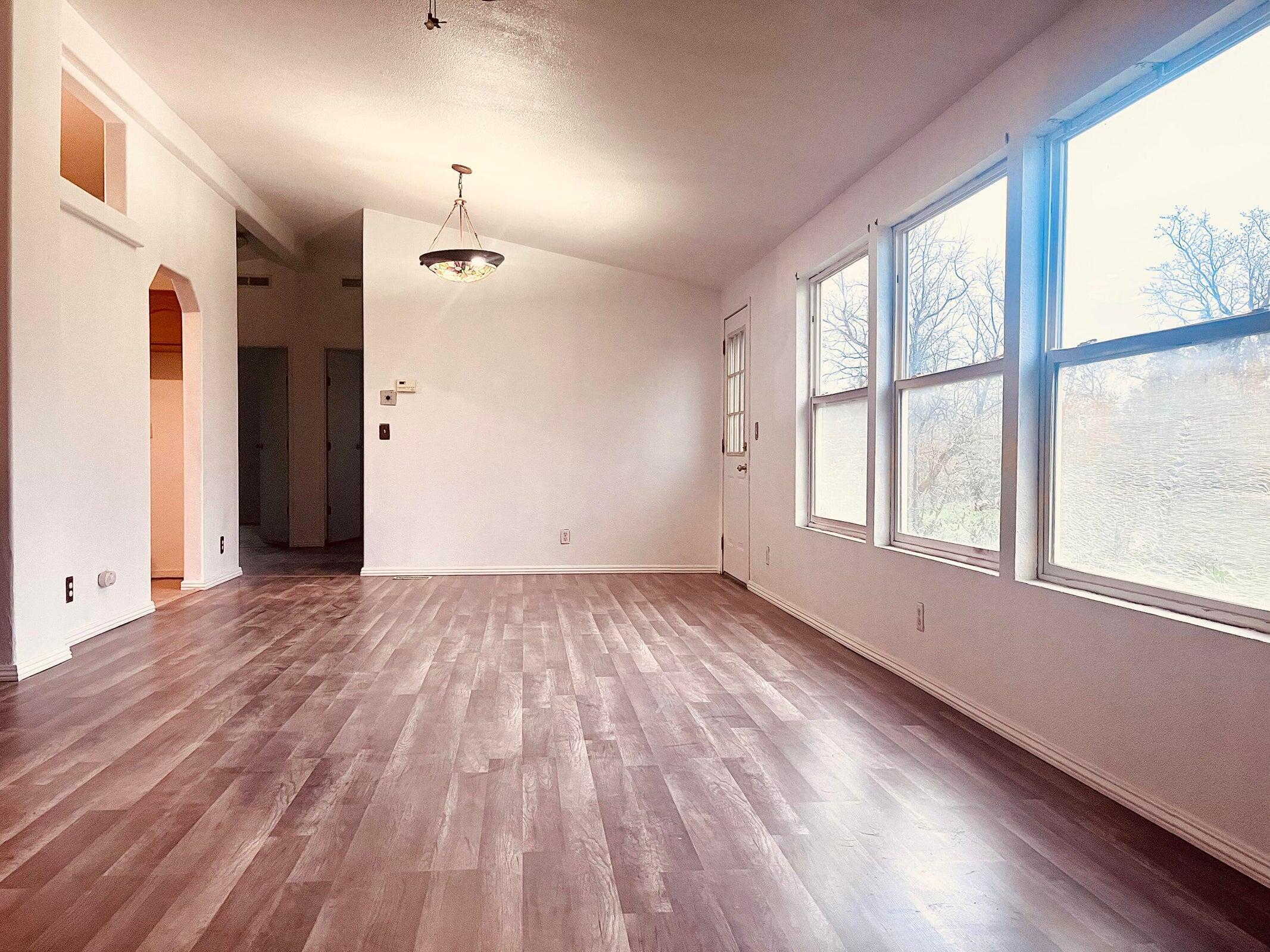 5321 Pine Street Anderson, CA 96007 - Photo 28 of 49 a view of an empty room with wooden floor and a window