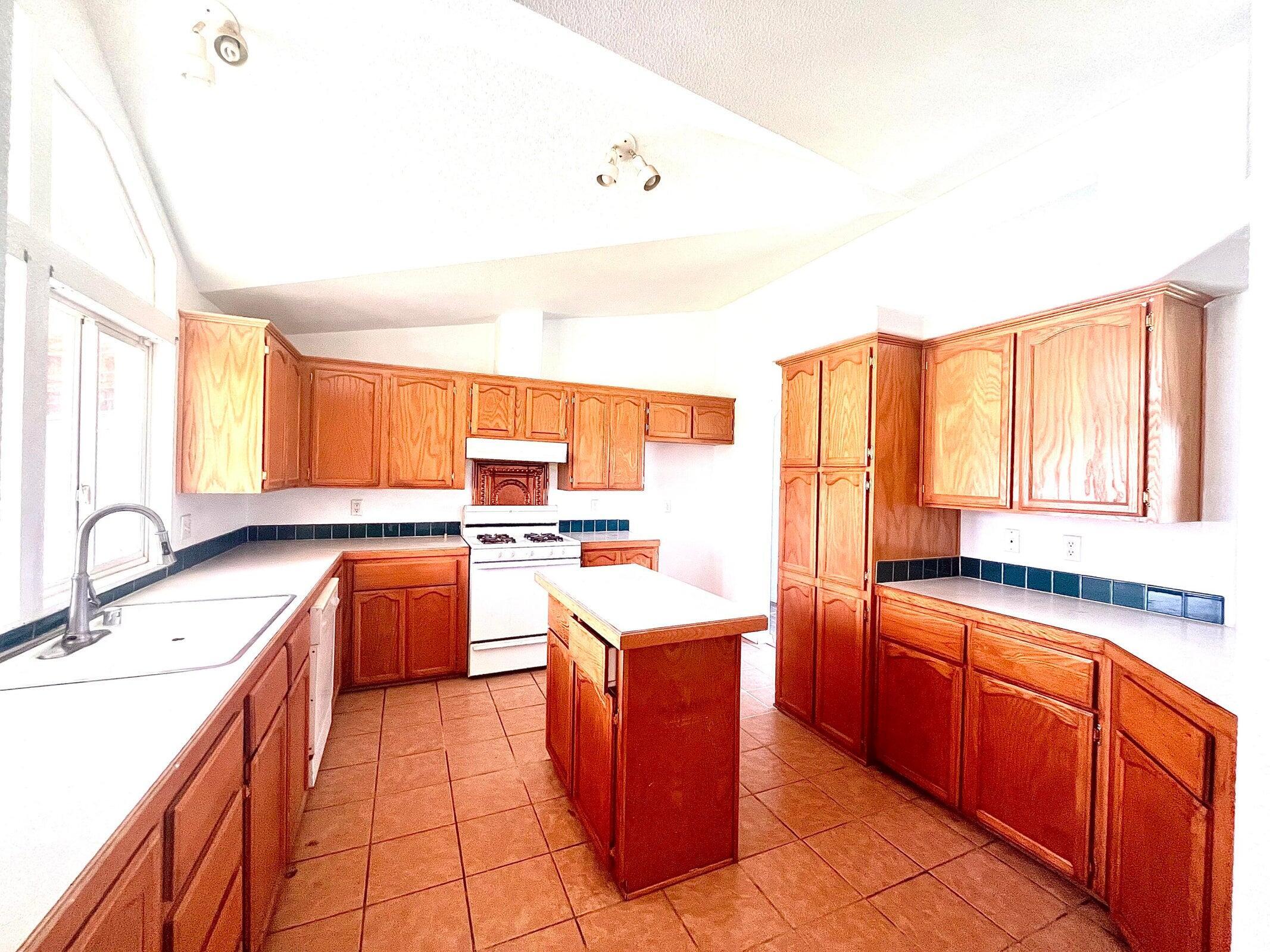 5321 Pine Street Anderson, CA 96007 - Photo 29 of 49 a large kitchen with stainless steel appliances granite countertop a sink and cabinets