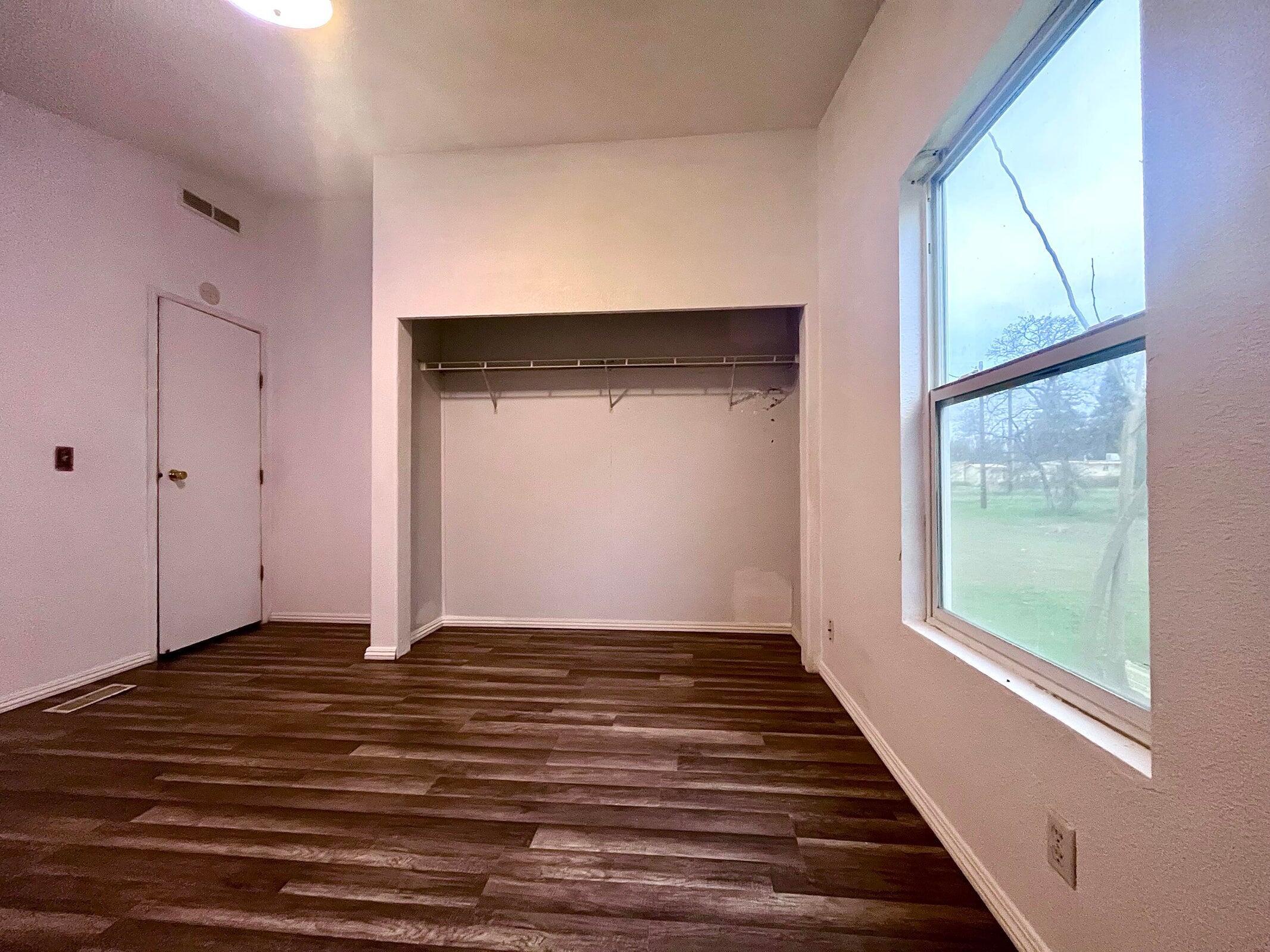 5321 Pine Street Anderson, CA 96007 - Photo 43 of 49 a view of an empty room with wooden floor and a window