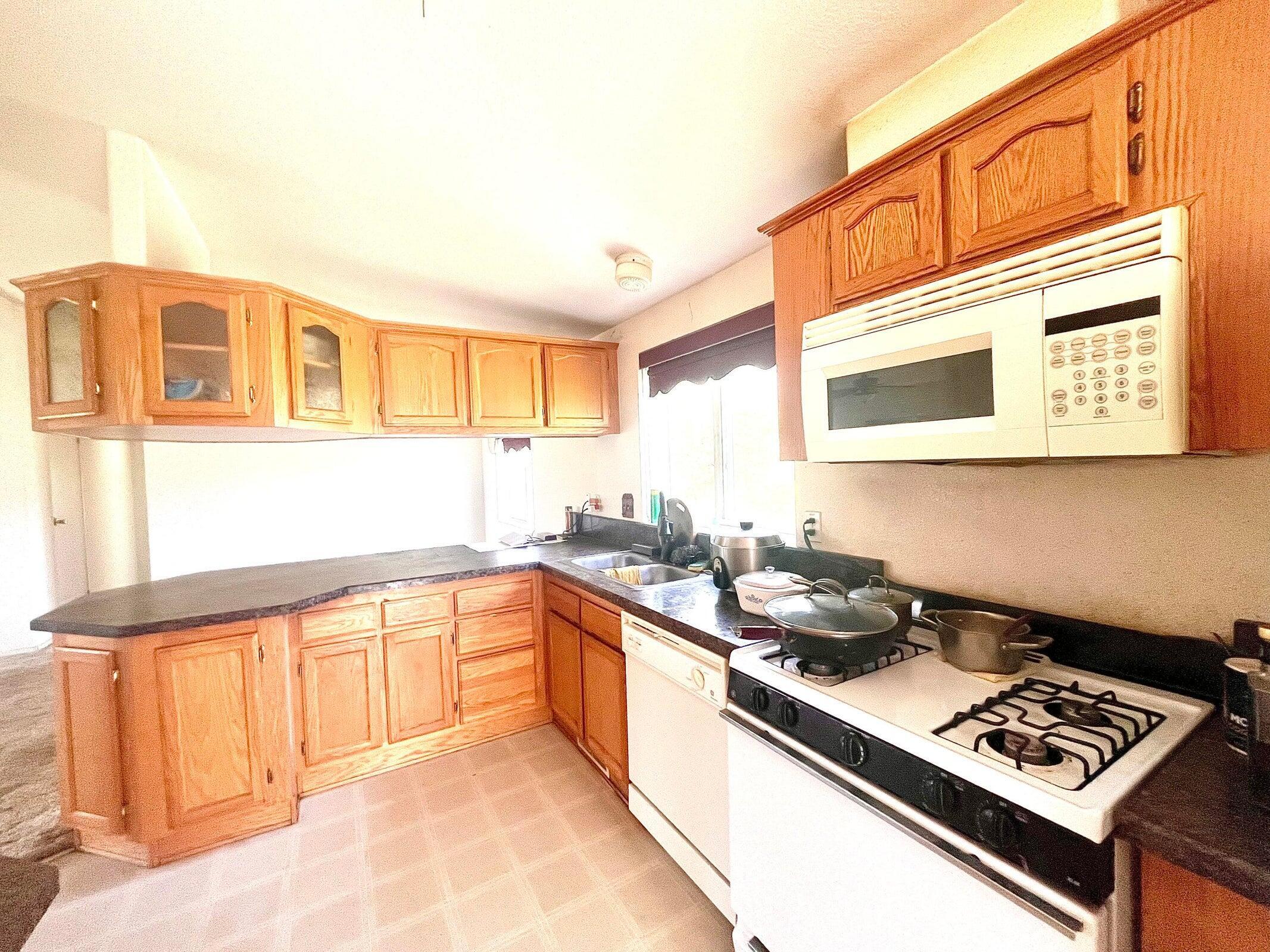 5321 Pine Street Anderson, CA 96007 - Photo 6 of 49 a kitchen with a stove a sink and cabinets