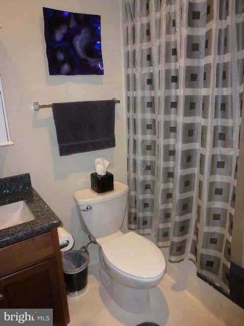 4159 Rush Street Fairfax, VA 22033 - Photo 20 of 30 a white toilet sitting next to a bathroom and a sink