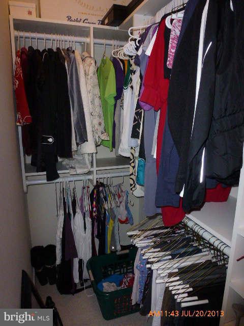 4159 Rush Street Fairfax, VA 22033 - Photo 22 of 30 a view of walk in closet with clothes and shoes
