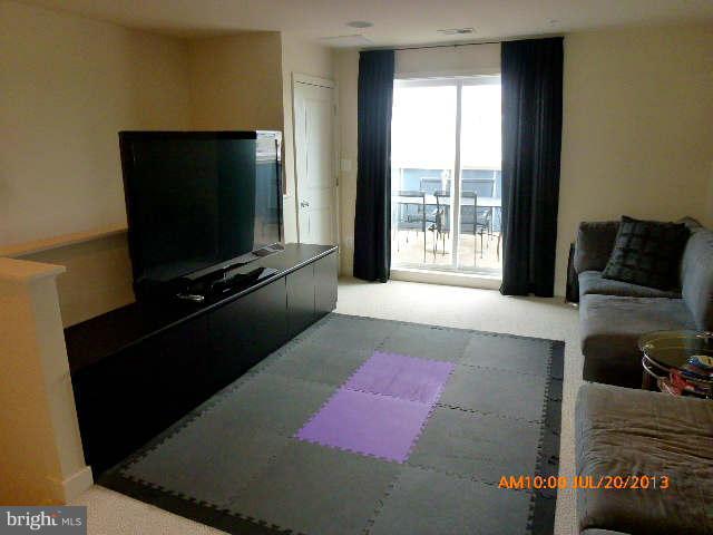 4159 Rush Street Fairfax, VA 22033 - Photo 24 of 30 a living room with furniture and a flat screen tv