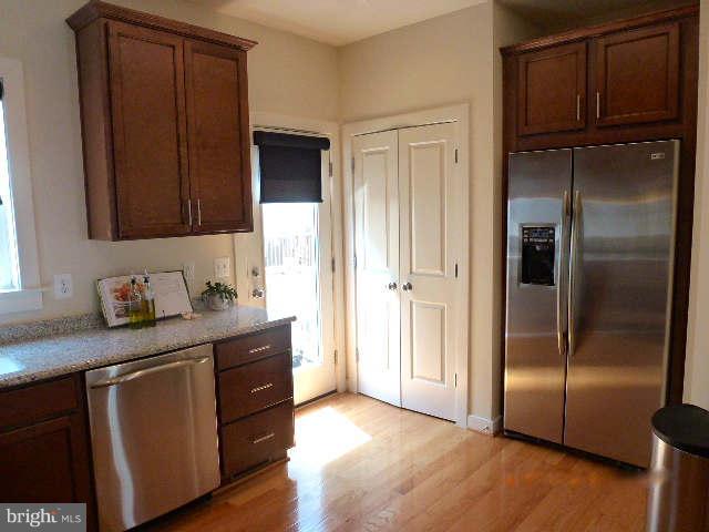 4159 Rush Street Fairfax, VA 22033 - Photo 5 of 30 a kitchen with stainless steel appliances granite countertop a refrigerator and a sink