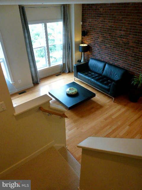 4159 Rush Street Fairfax, VA 22033 - Photo 9 of 30 a living room with furniture and a fireplace