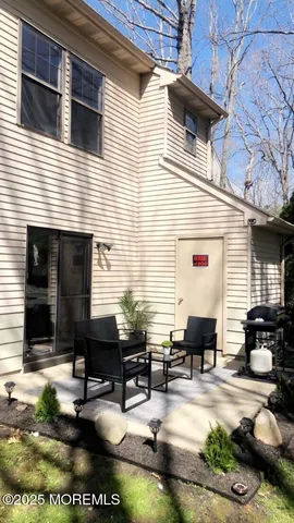 a backyard of a house with seating space