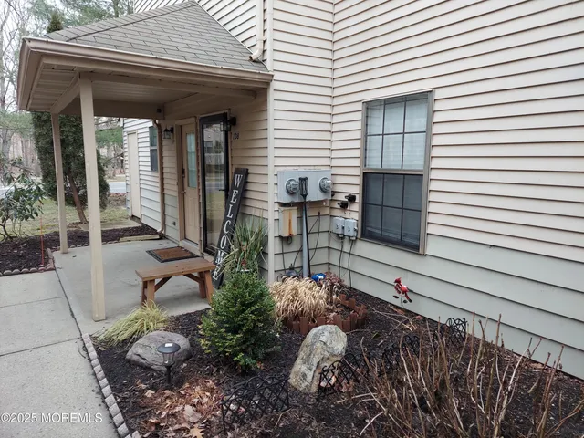 a view of backyard with patio