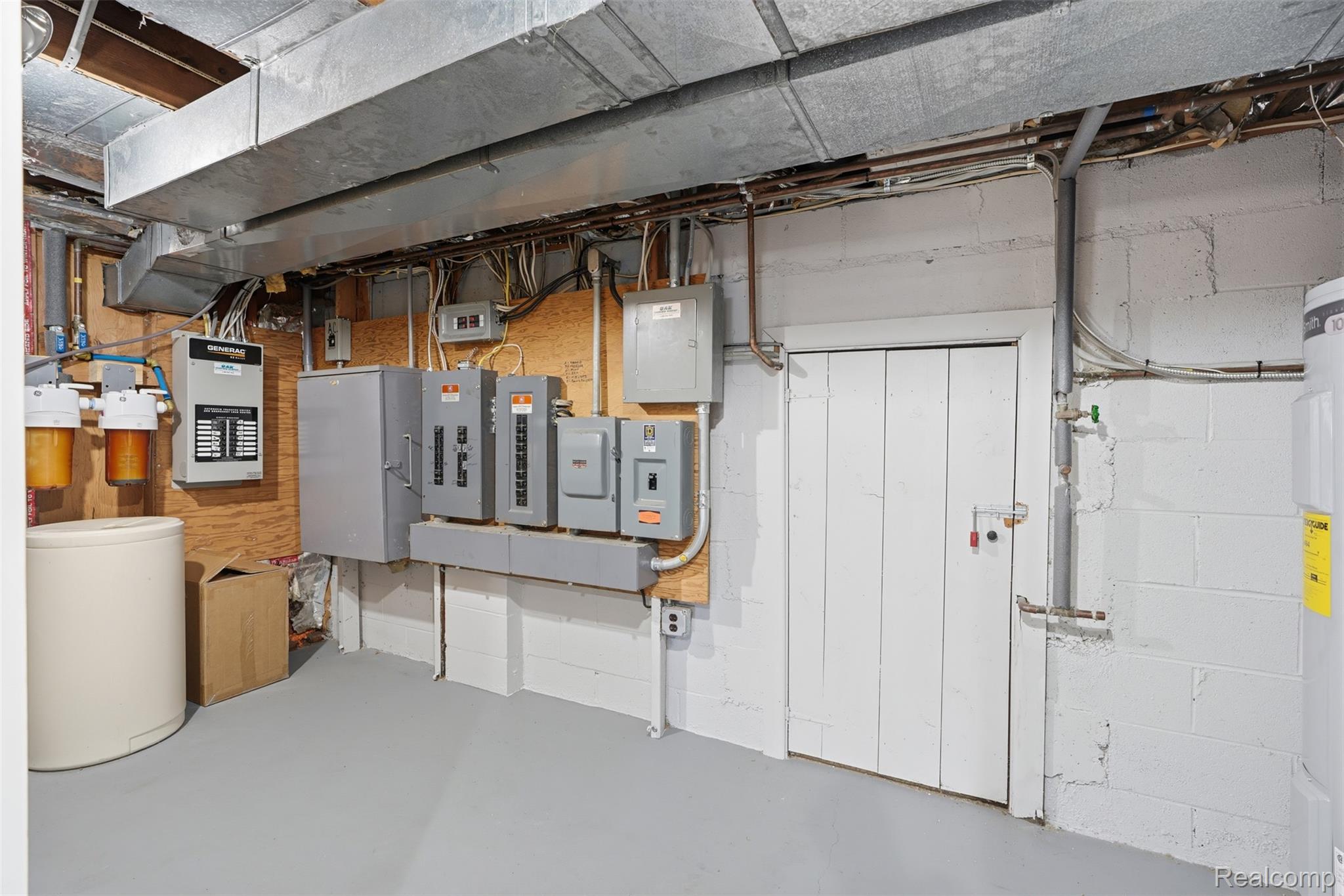 8636 Tindall Road Davisburg, MI 48350 - Photo 36 of 61 Utility room featuring electric panel and electric water heater
