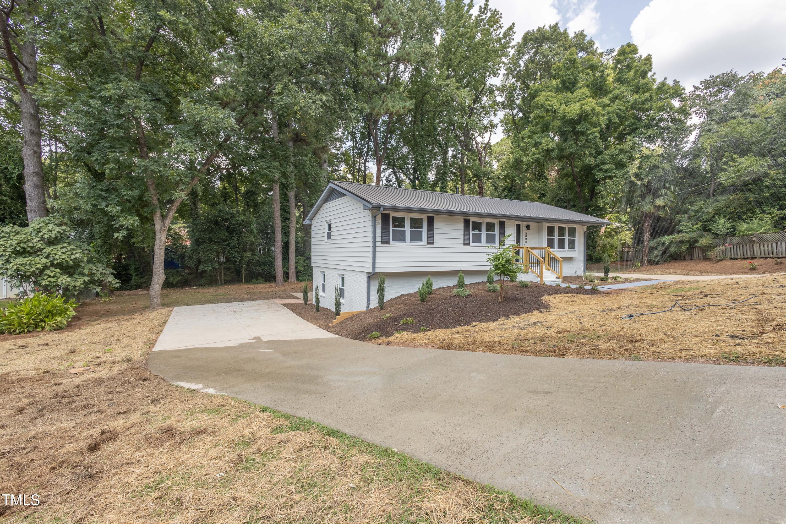 5006 Newcastle Road Raleigh, NC 27606 - Photo 51 of 52 front left driveway