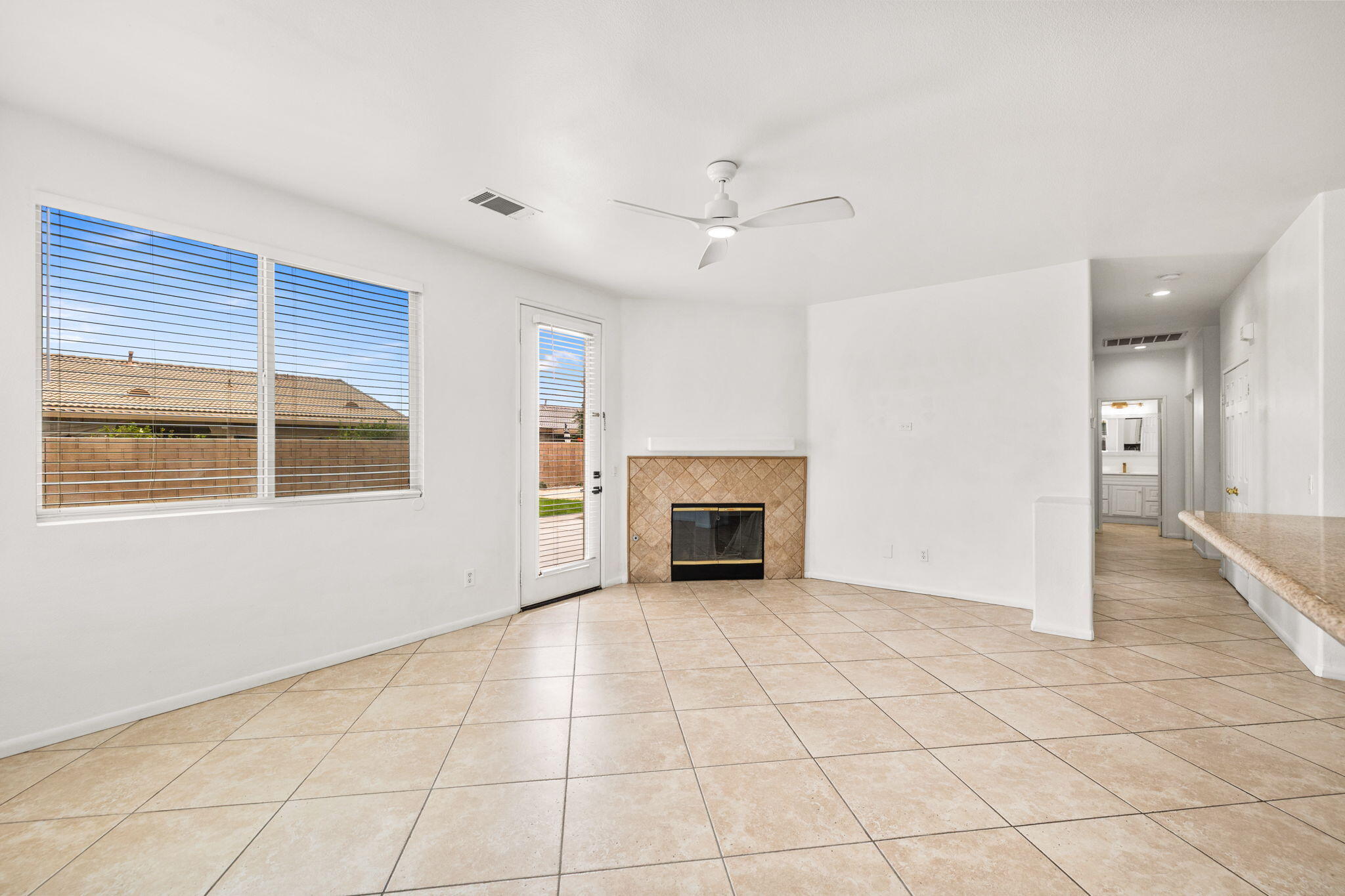 47558 Bison Circle Indio, CA 92201 - Photo 13 of 38 a view of an empty room with a fireplace