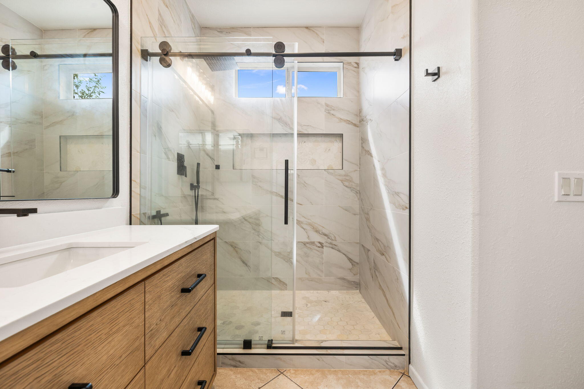 47558 Bison Circle Indio, CA 92201 - Photo 18 of 38 a bathroom with a shower and a sink