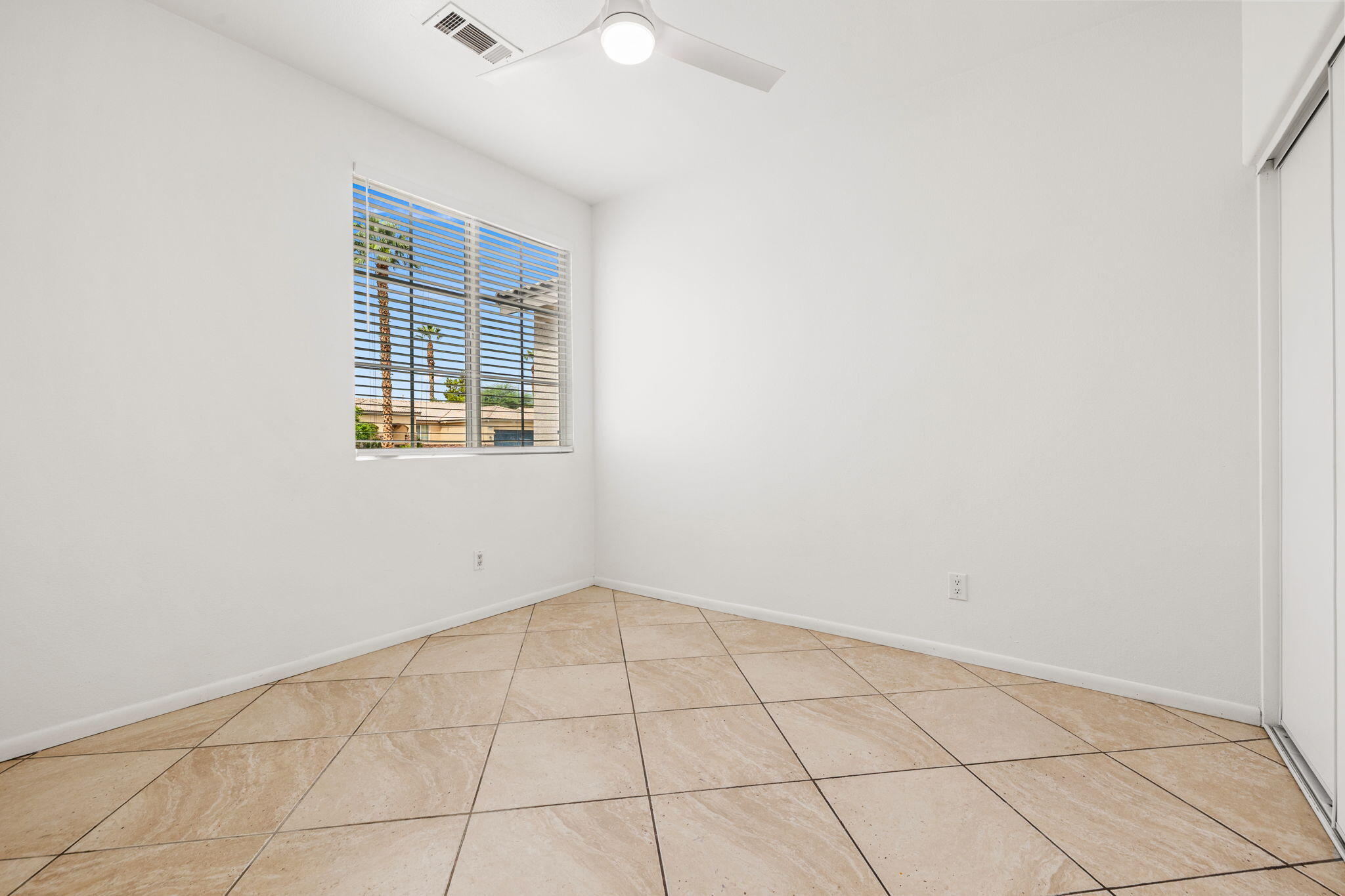 47558 Bison Circle Indio, CA 92201 - Photo 22 of 38 an empty room with windows