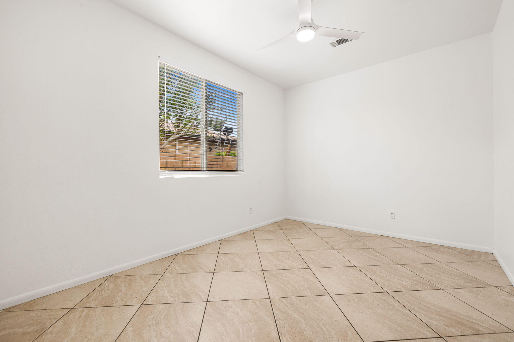47558 Bison Circle Indio, CA 92201 - Photo 26 of 38 an empty room with windows
