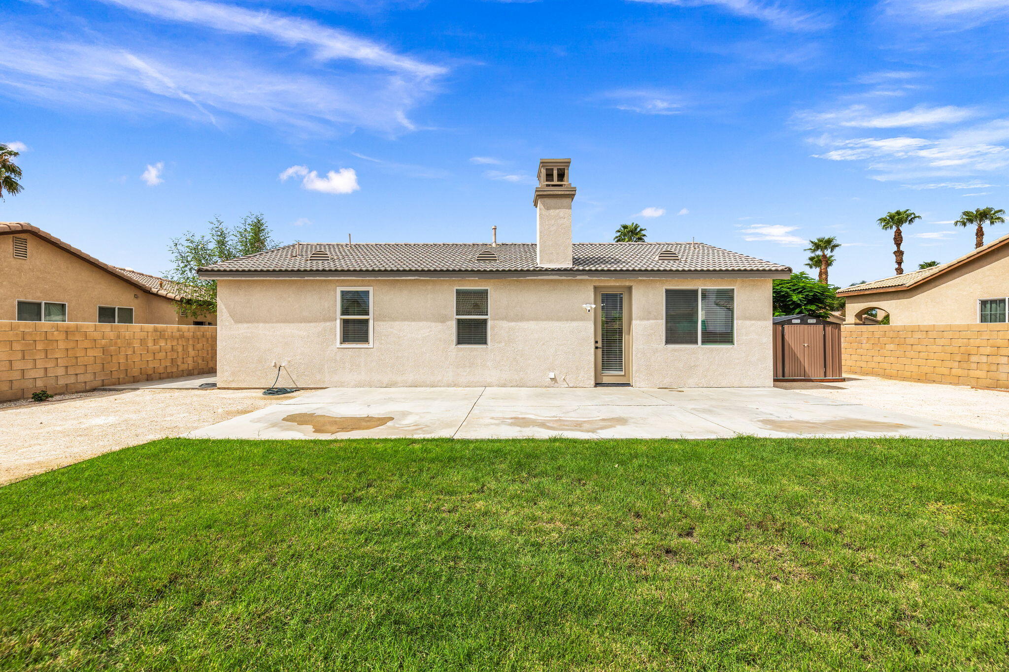 47558 Bison Circle Indio, CA 92201 - Photo 28 of 38 a front view of a house with a yard and garage